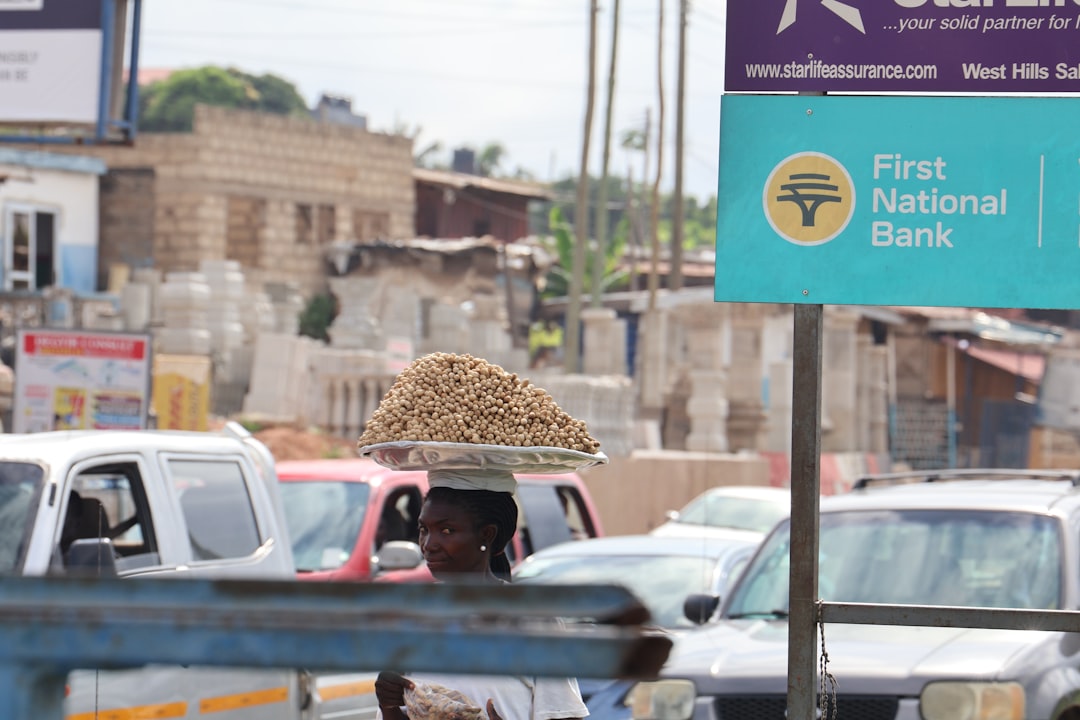A street scene with focus on a sign - FintechFalcon.com